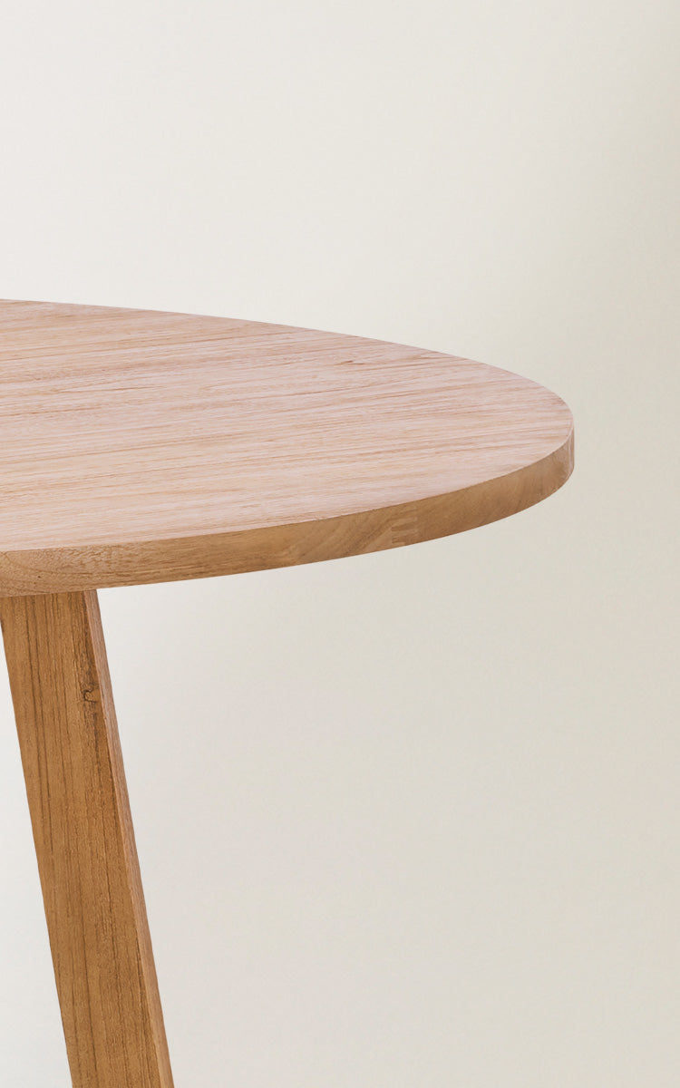 This is a close-up image of Aksel Dining Table in teak indoor.