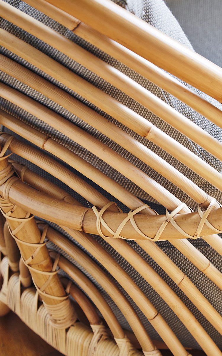 This is a close-up image of Charlottenborg Sofa in polished Natural Rattan.