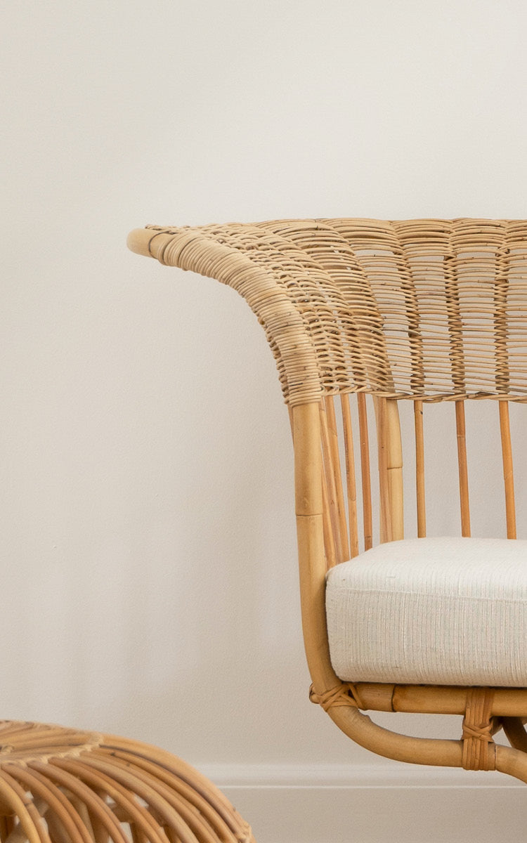This is a close-up image of Belladonna Sofa in polished natural rattan.