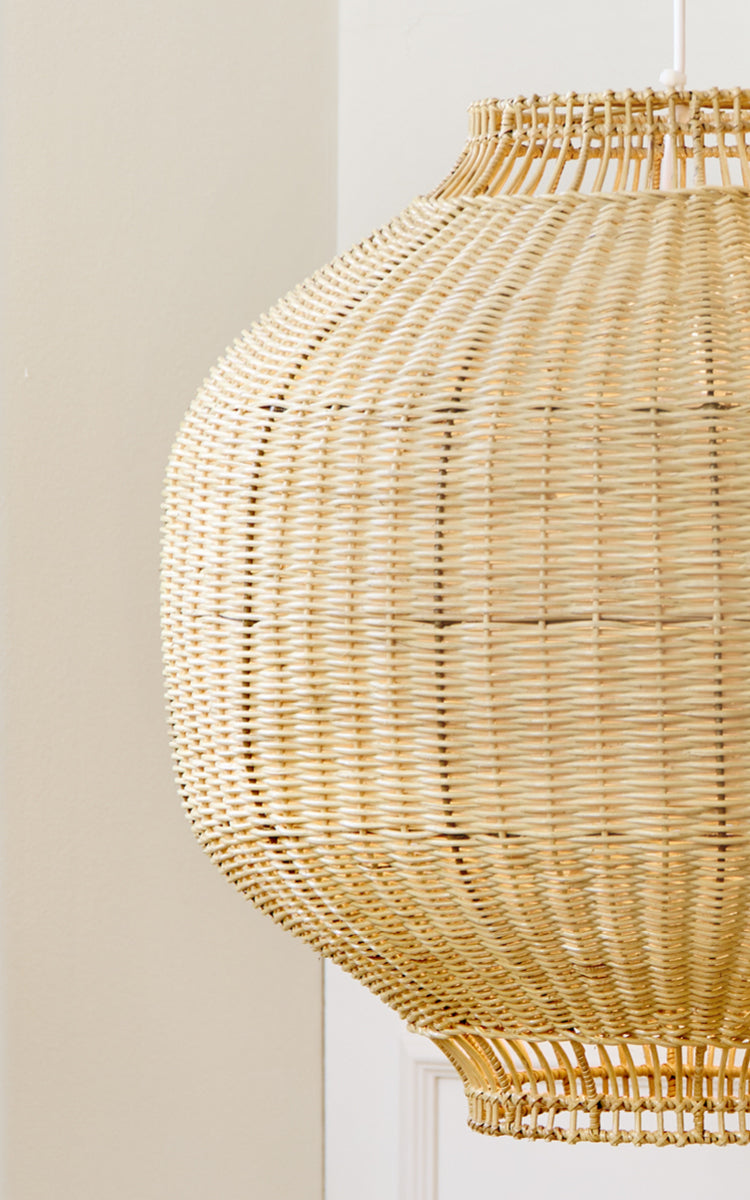 This is a close-up image of Tomori Lampshade in natural core weave rattan frame. The large barrel shape with delicate weave detail is shown.