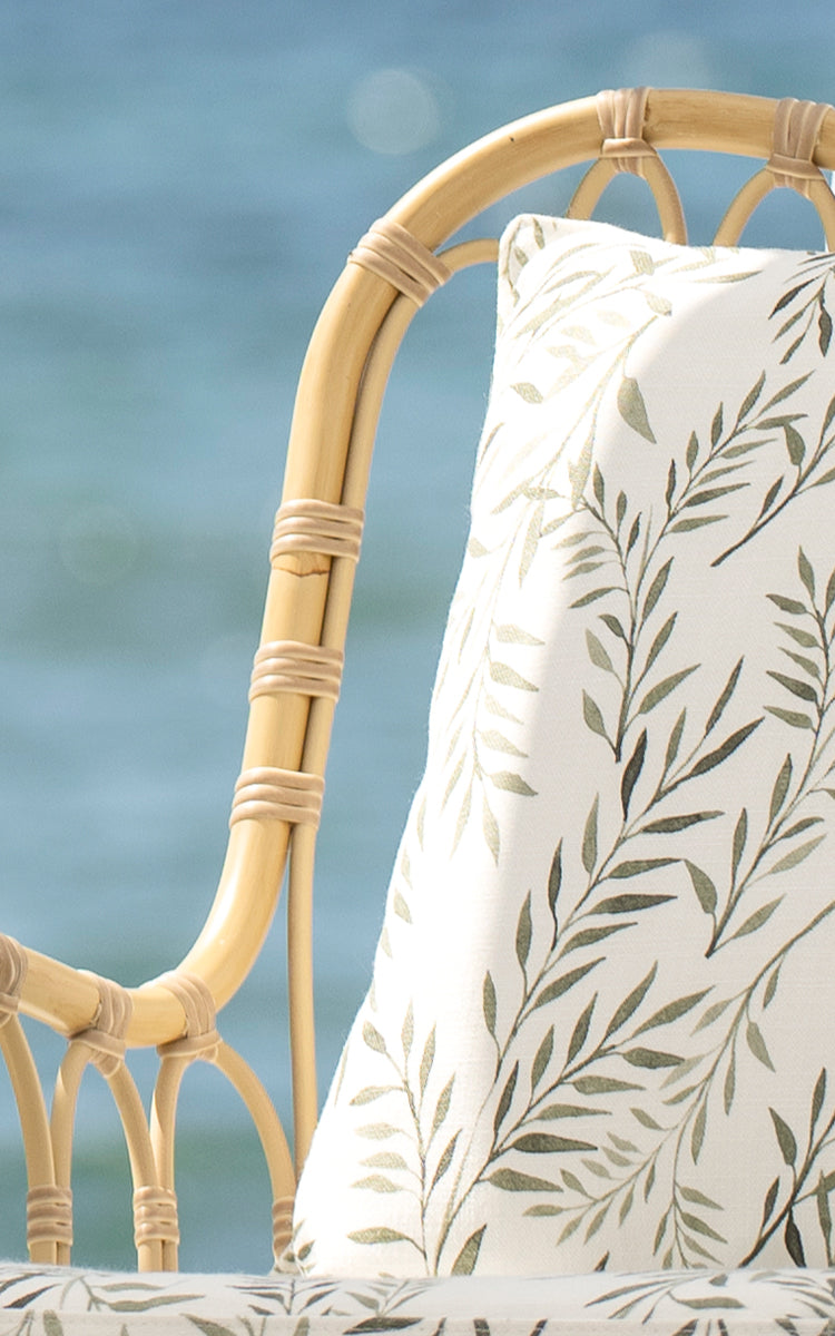 This is a close-up image of Tulip Exterior Lounge Chair in natural aluminium artfibre. Detail of the woven texture and frame construction.