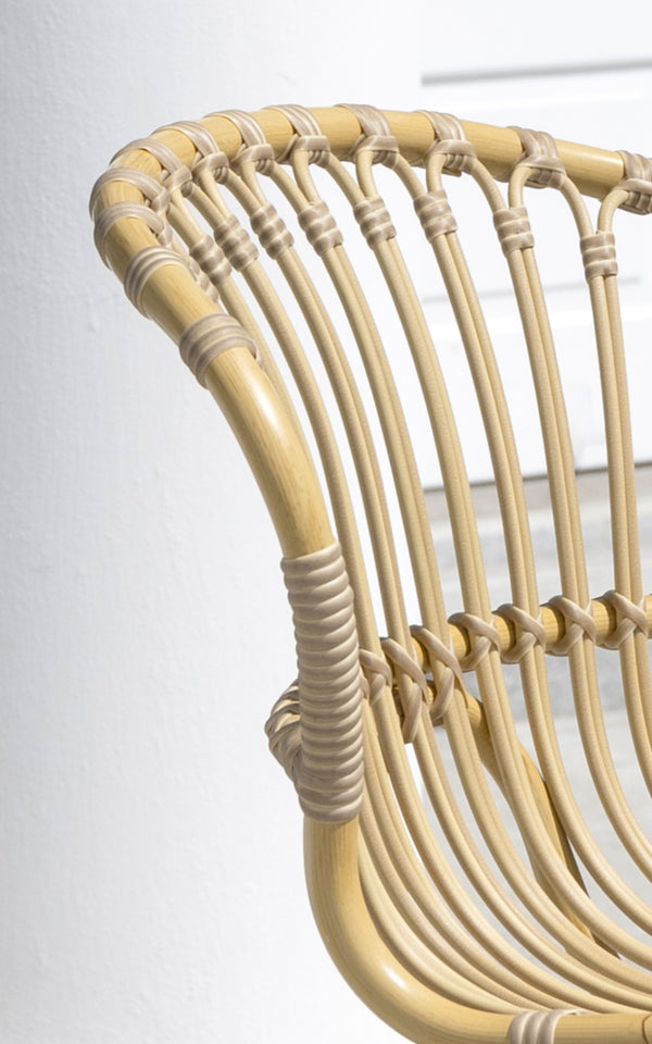 This is a close-up image of Rita Exterior Dining Chair in natural aluminium artfibre. Detail of the woven texture and frame construction.