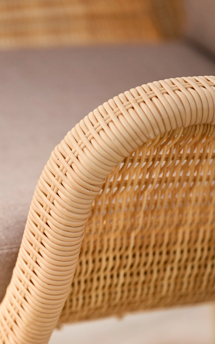 This is a close-up image of Madame Lounge Chair in natural core weave ArtFibre Aluminium.