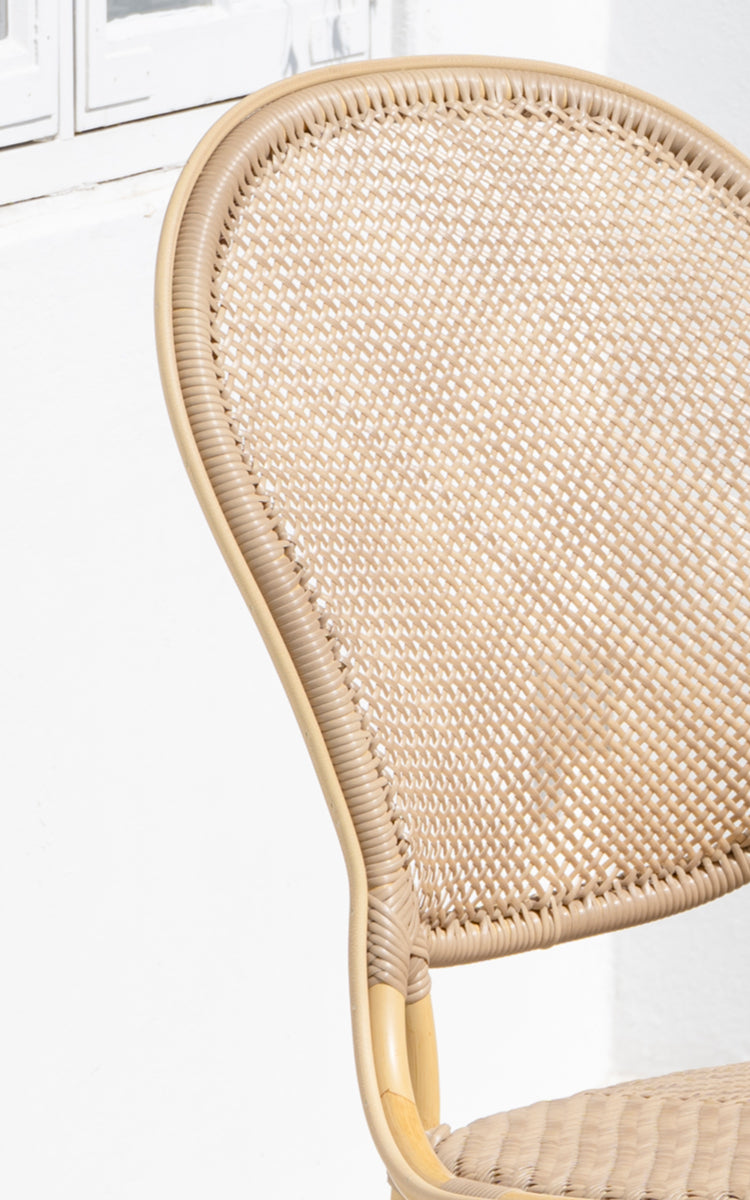 This is a close-up image of Rossini Exterior Dining Chair in natural aluminium artfibre. Detail of the woven texture and frame construction.