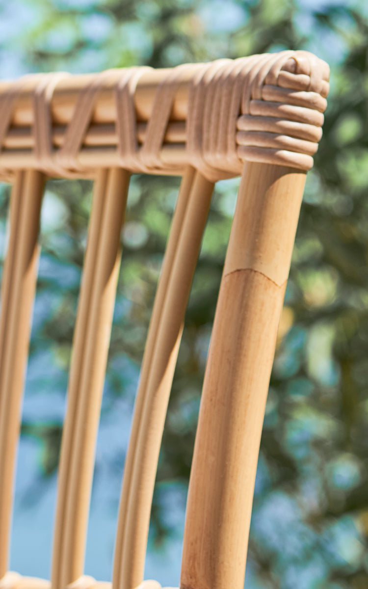 This is a close-up image of Maggie Sofa Center Module in natural aluminium artfibre. Wrapped frame joints and vertical slat detail in sunlight.