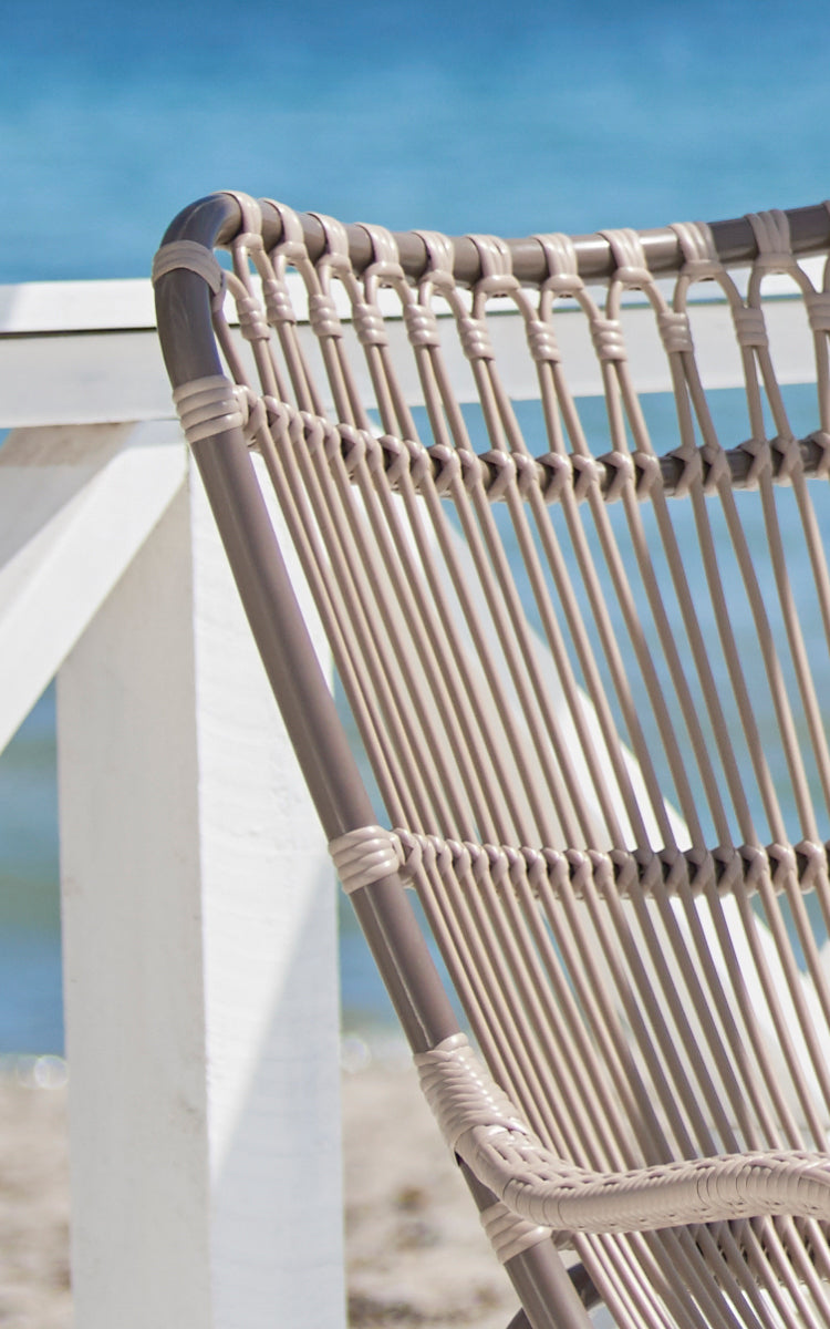 This is a close-up image of Monet Exterior Lounge Chair in moccaccino aluminium artfibre.