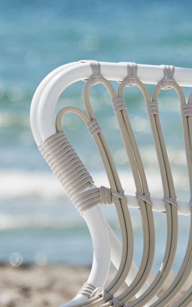 This is a close-up image of Fox Exterior Lounge Chair in dove white Aluminium ArtFibre.