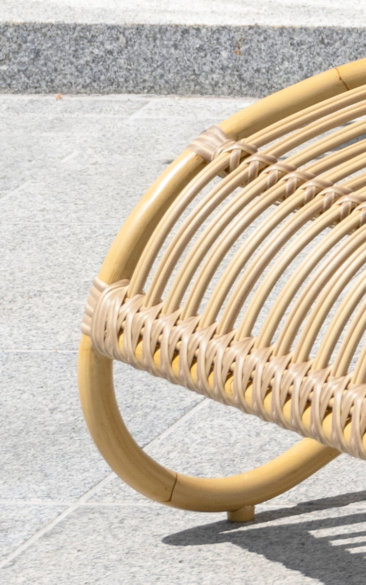 This is a close-up image of Teddy Exterior Footstool in natural aluminium artfibre. Detail of the woven texture and frame construction.