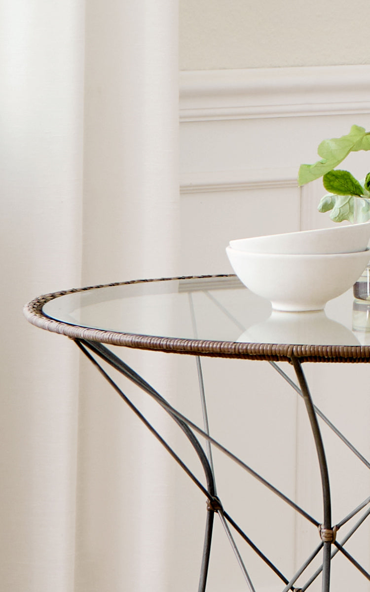 This is a close-up image of Funky Dining Chair in hazelnut rattan iron frame.