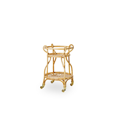 Side view of Fratellino rattan trolley in natural color, designed by Franco Albini & Franca Helg. Elegant wicker trolley with curved shapes and detailed weavings handcrafted from high-quality Indonesian rattan.