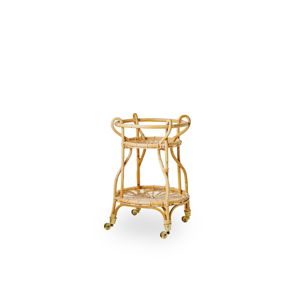 Side view of Fratellino rattan trolley in natural color, designed by Franco Albini & Franca Helg. Elegant wicker trolley with curved shapes and detailed weavings handcrafted from high-quality Indonesian rattan.