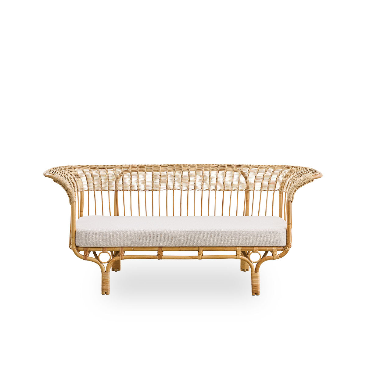 Front view of Belladonna sofa in natural rattan, designed by Franco Albini and Franca Helg. The sofa has an elegant expression with thin legs and a majestic seat with many detailed windings.