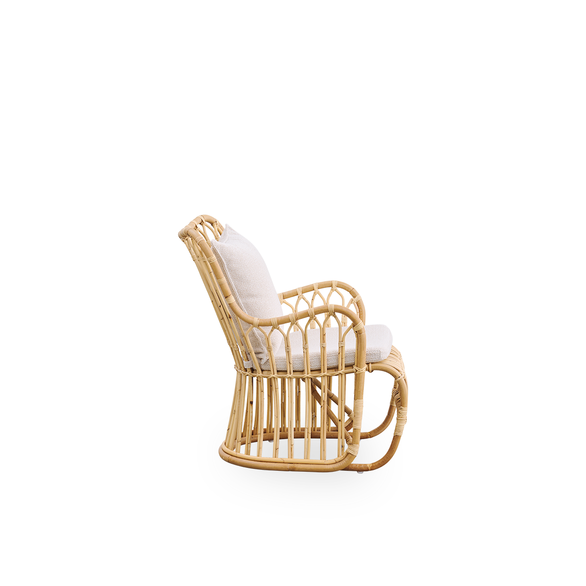 Plain side view of Tulip lounge chair designed by Tove Kindt-Larsen, with soft organic lines. Handcrafted from high-quality Indonesian rattan
