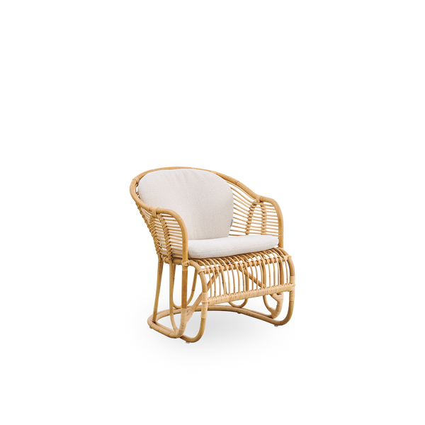 Side view of Swing lounge chair designed by Tove Kindt-Larsen. Handcrafted from high-quality Indonesian rattan and fitted with seat and back cushion.