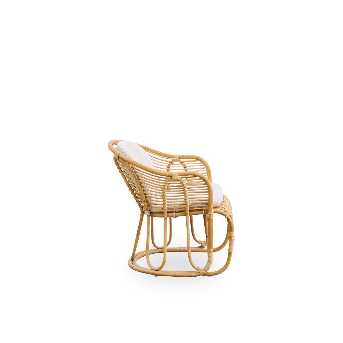 Plain side view of Swing lounge chair designed by Tove Kindt-Larsen. Handcrafted from high-quality Indonesian rattan and fitted with seat and back cushion.