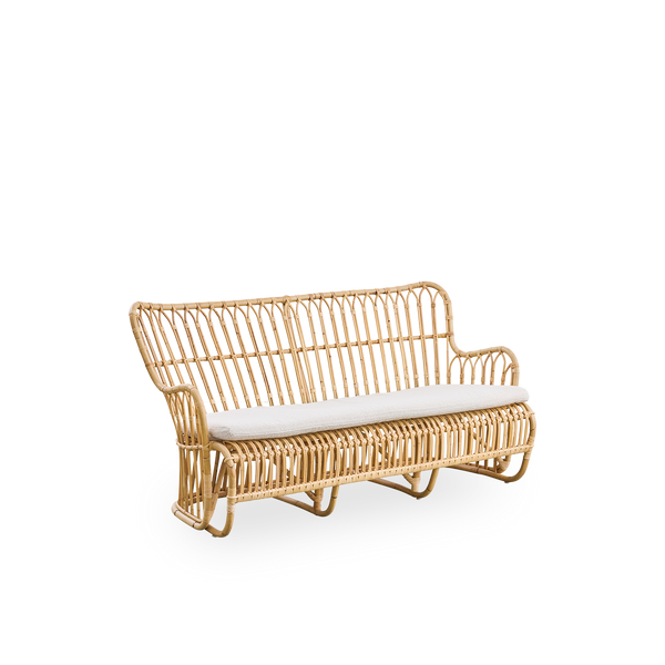 Side view of Tulip wicker sofa designed by Tove Kindt-Larsen, with soft organic lines. Handcrafted from high-quality Indonesian rattan