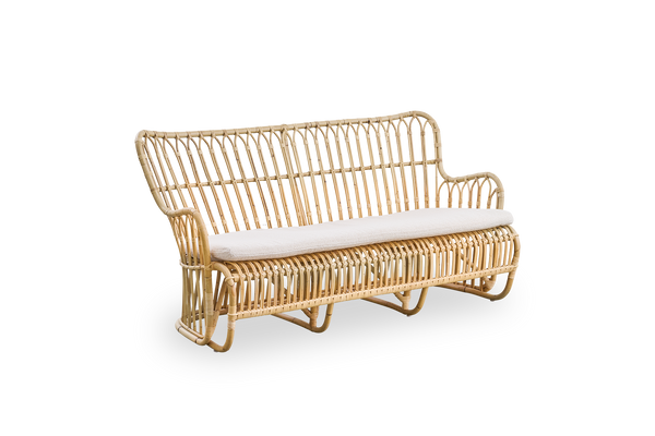 Side view of Tulip wicker sofa designed by Tove Kindt-Larsen, with soft organic lines. Handcrafted from high-quality Indonesian rattan