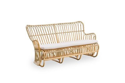 Side view of Tulip wicker sofa designed by Tove Kindt-Larsen, with soft organic lines. Handcrafted from high-quality Indonesian rattan