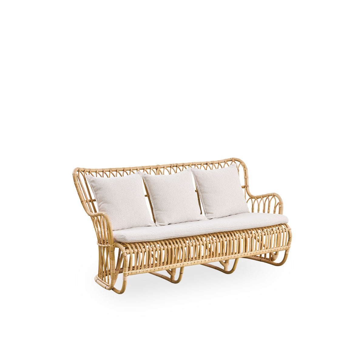 Side view of Tulip wicker sofa designed by Tove Kindt-Larsen, with soft organic lines. Handcrafted from high-quality Indonesian rattan