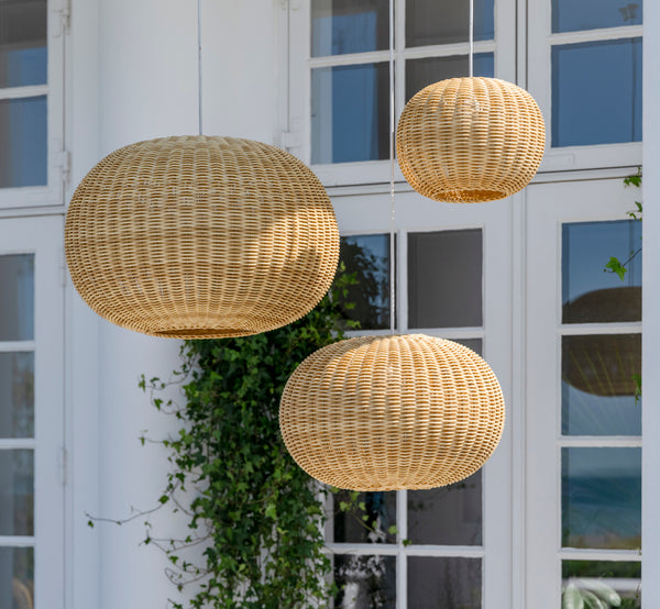 This is a lifestyle image of Tangelo Exterior Lampshade Ø24 cm | Extra Small in natural core weave artfibre & aluminium.
