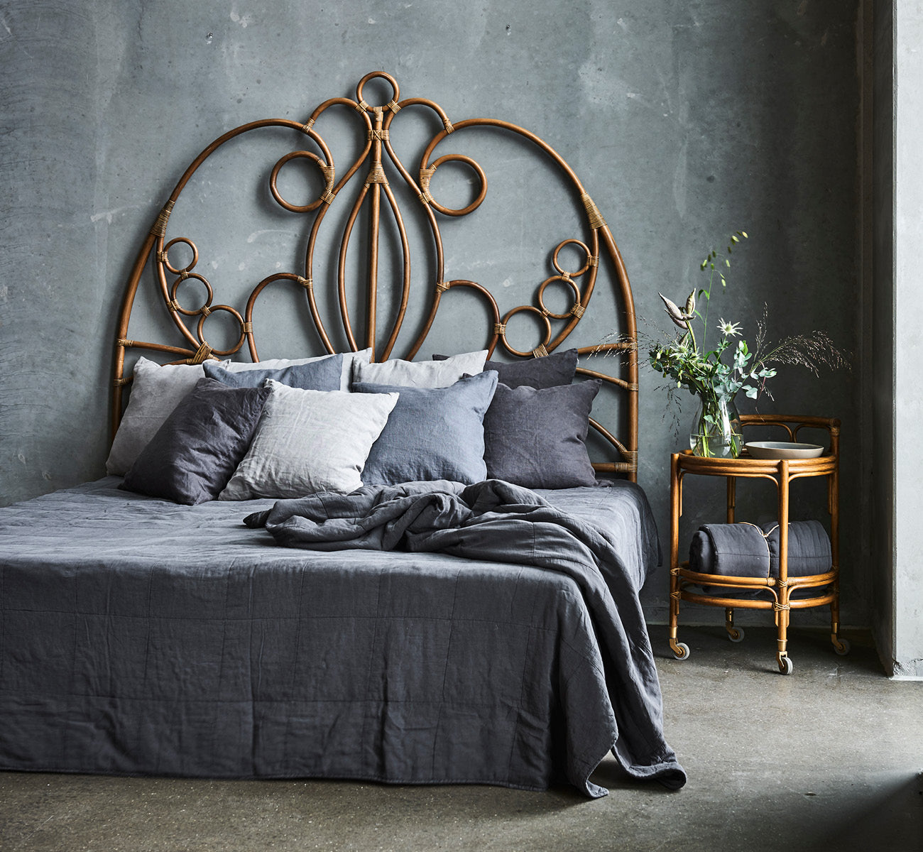 This is a lifestyle image of CTE058DB Bedspread in dusty Blue Cotton, in a serene bedroom with neutral decor and herringbone parquet.