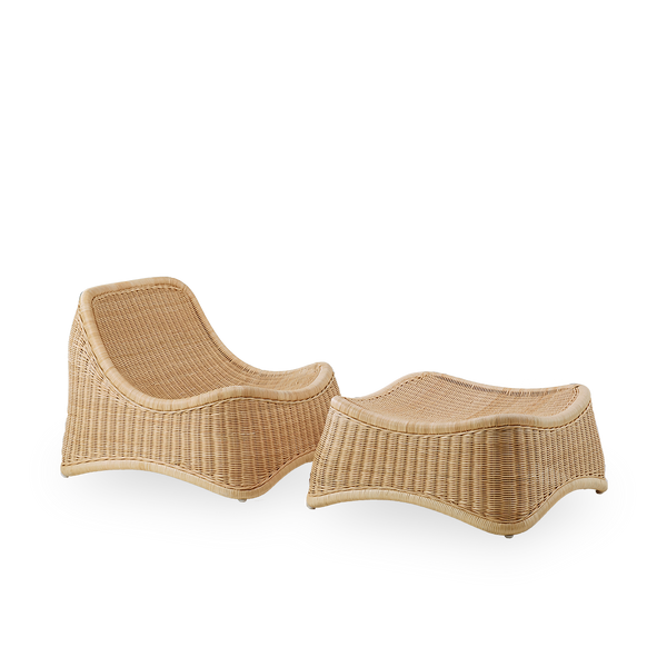 Side view of Chill Exterior lounge chair, a fully woven outdoor chair with a matching footstool designed by Nanna Ditzel. The chair has no armrests and is handcrafted from high quality Indonesian rattan.