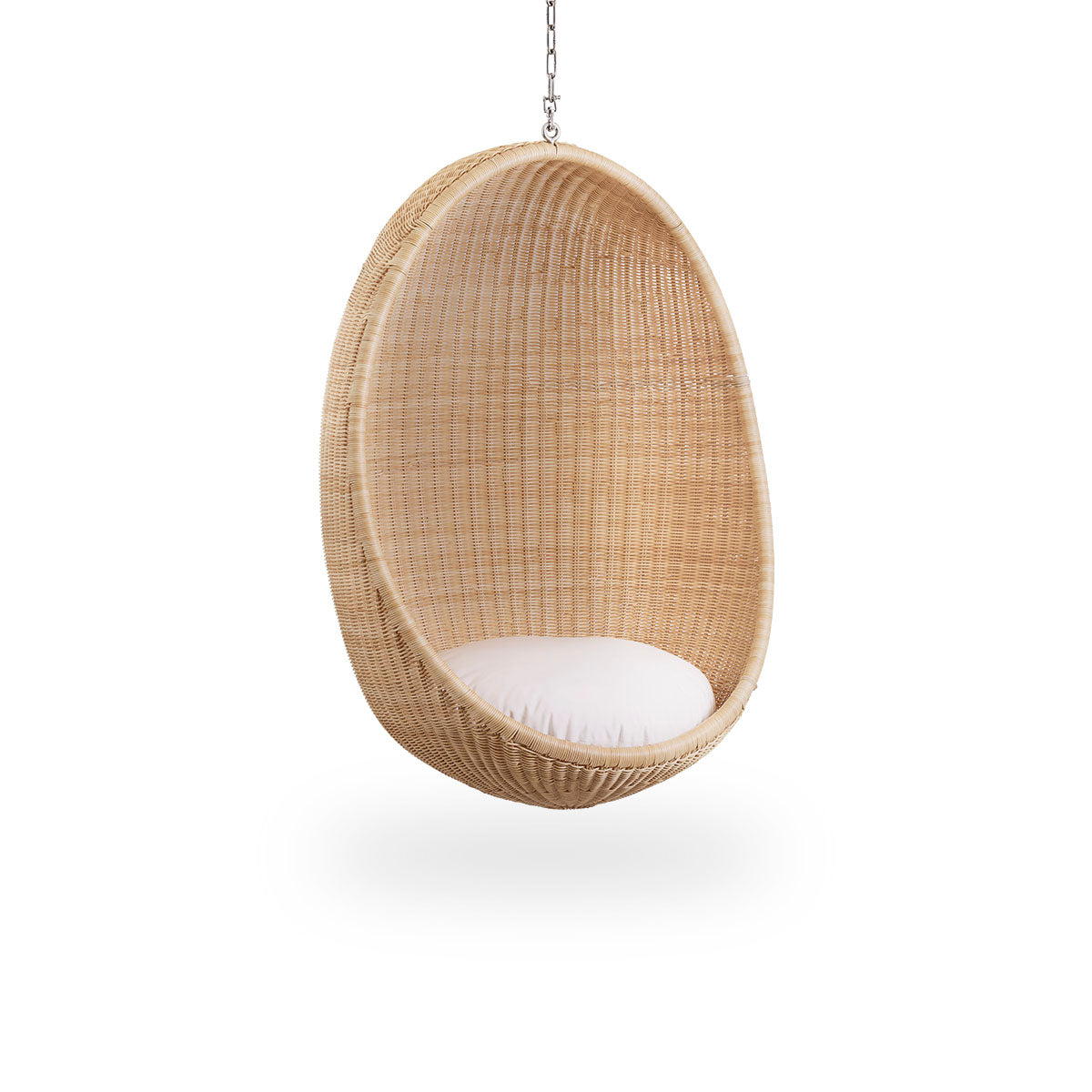 Side view of Hanging Egg, an iconic hammock chair designed by Nanna and Jørgen Ditzel. The round hanging chair is fully woven from high-quality Indonesian rattan and hangs in a metal chain.