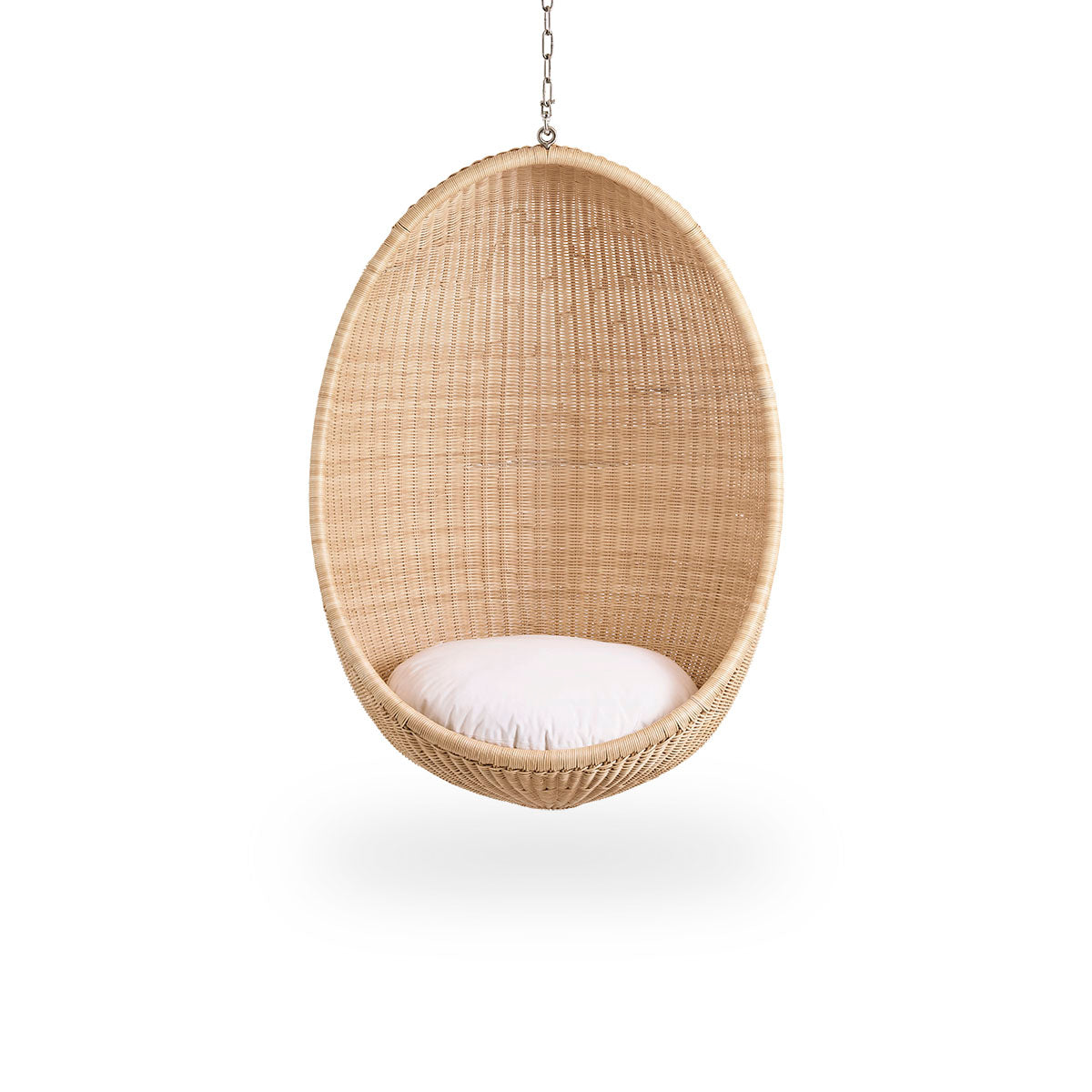 Front view of the Hanging Egg, an iconic hammock chair designed by Nanna and Jørgen Ditzel.
The round hanging chair is fully woven from high-quality Indonesian rattan and hangs from a metal chain.