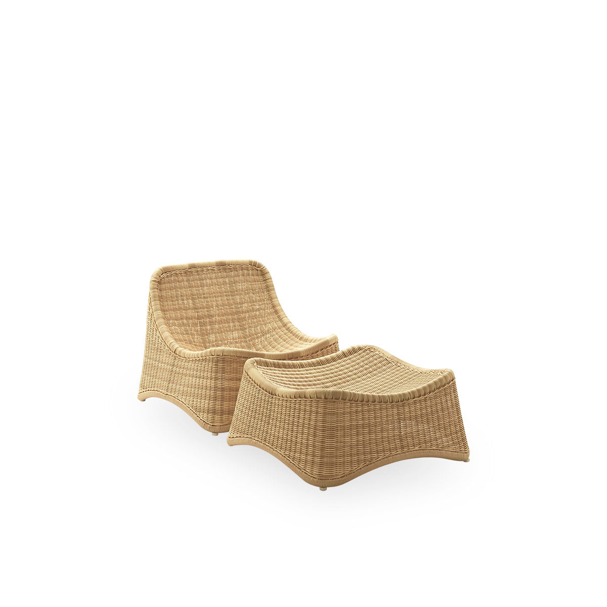Side view of Chill Exterior lounge chair, a fully woven outdoor chair with a matching footstool designed by Nanna Ditzel. The chair has no armrests and is handcrafted from Alu-Rattan and ArtFibre.