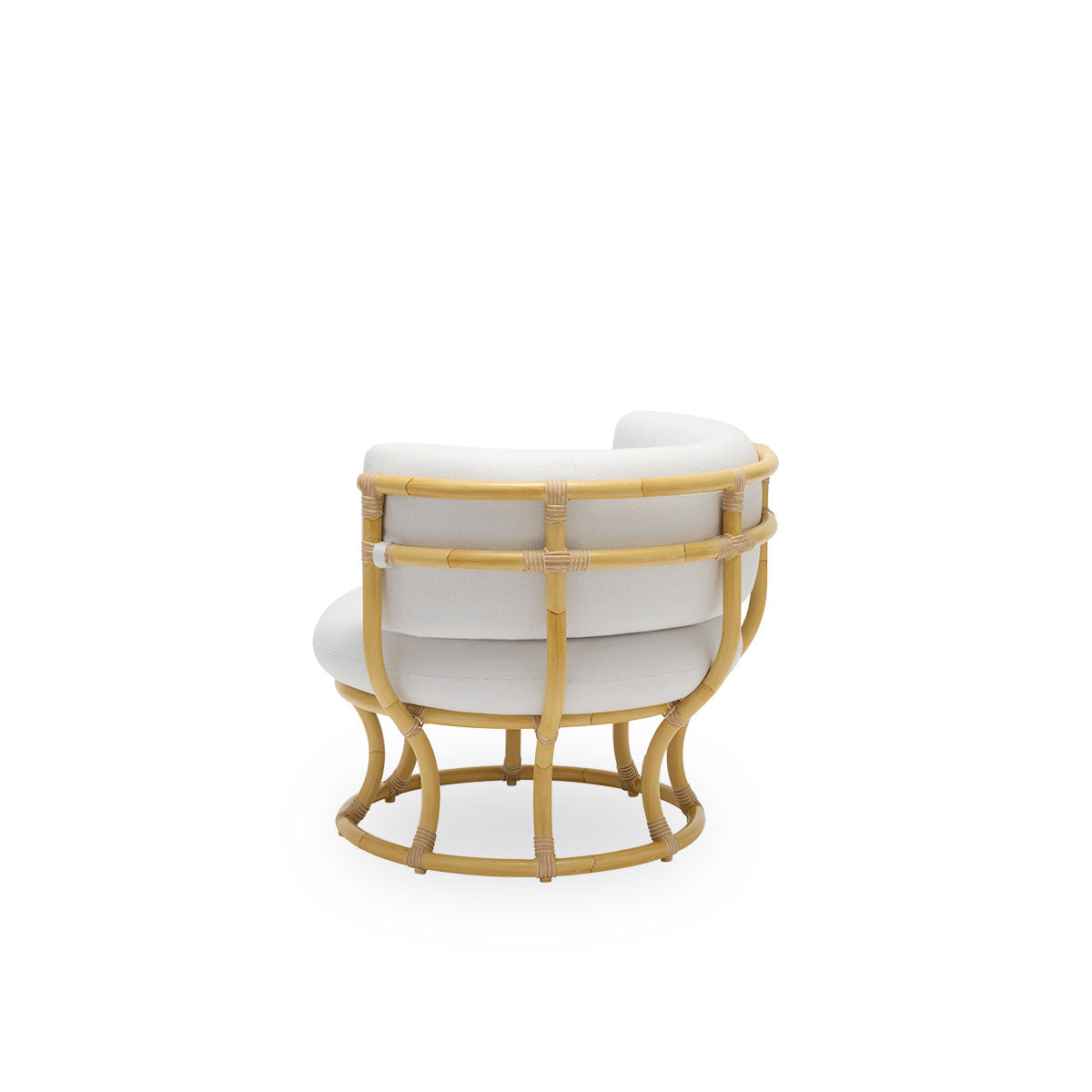 Back side view of the Coco Exterior lounge chair in rattan look, designed by Nanna Ditzel. The design is based on perfect circles and features an aluminium frame with ArtFibre weave details.