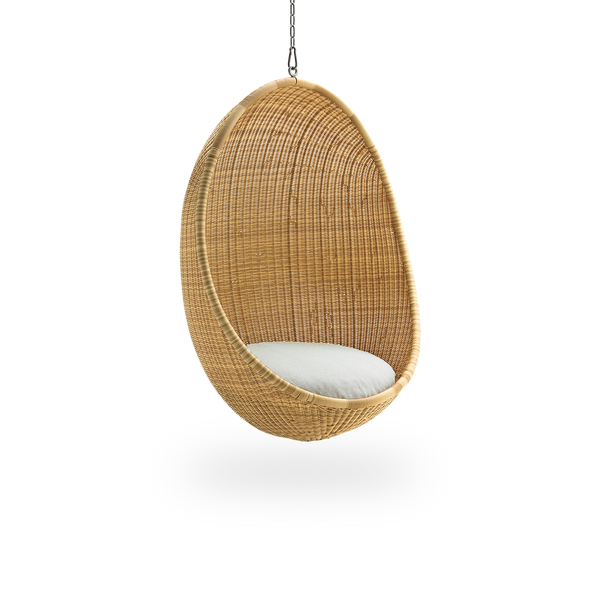 Side view of Hanging Egg Exterior in the color Natural. The hanging chair has a round shape and is fully woven ArtFibre on an aluminium frame.