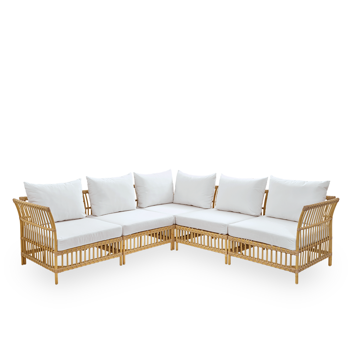 Side view of Maggie outdoor sofa corner module in Natural color presented with white seat and back cushion. Aluminium frame with handpainted rattan look with ArtFibre windings.