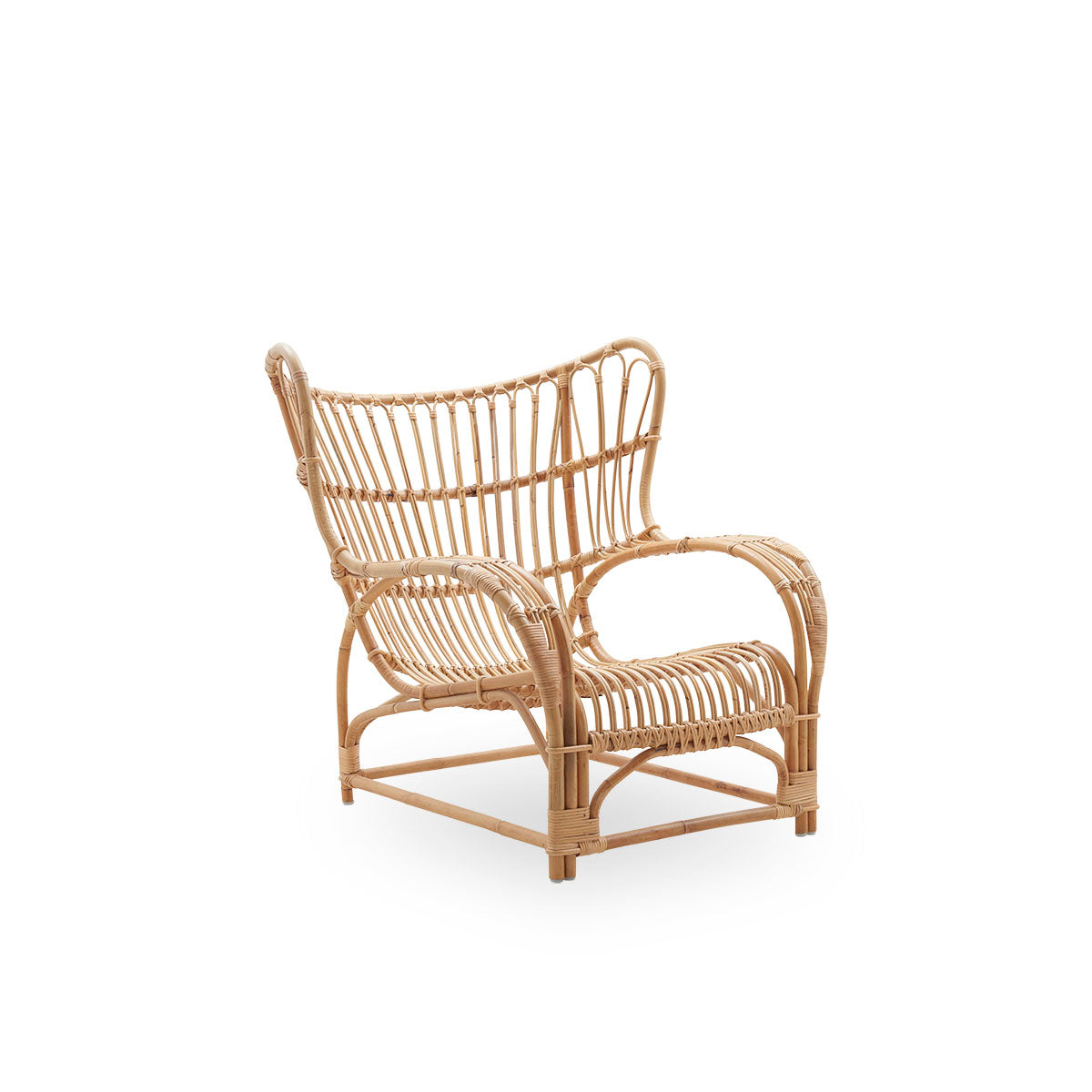 Side view of Teddy lounge chair by Viggo Boesen, big embracing lounge chair inspired by the 19th-century wing chair. Handcrafted from high quality Indonesian rattan