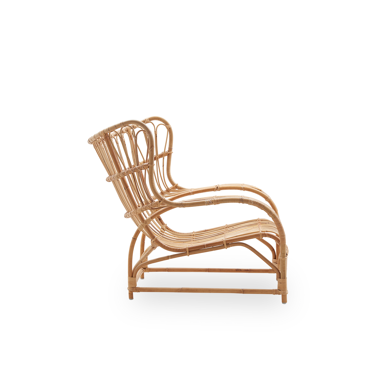 Plain side view of Teddy lounge chair by Viggo Boesen, big embracing lounge chair inspired by the 19th-century wing chair. Handcrafted from high quality Indonesian rattan