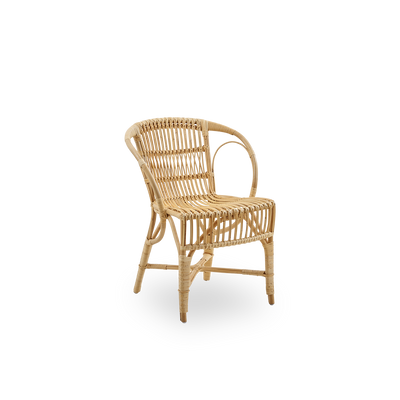 Side view of Robert dining chair in natural color designed by Robert W. Elegant wicker chair handcrafted from high-quality Indonesian rattan.