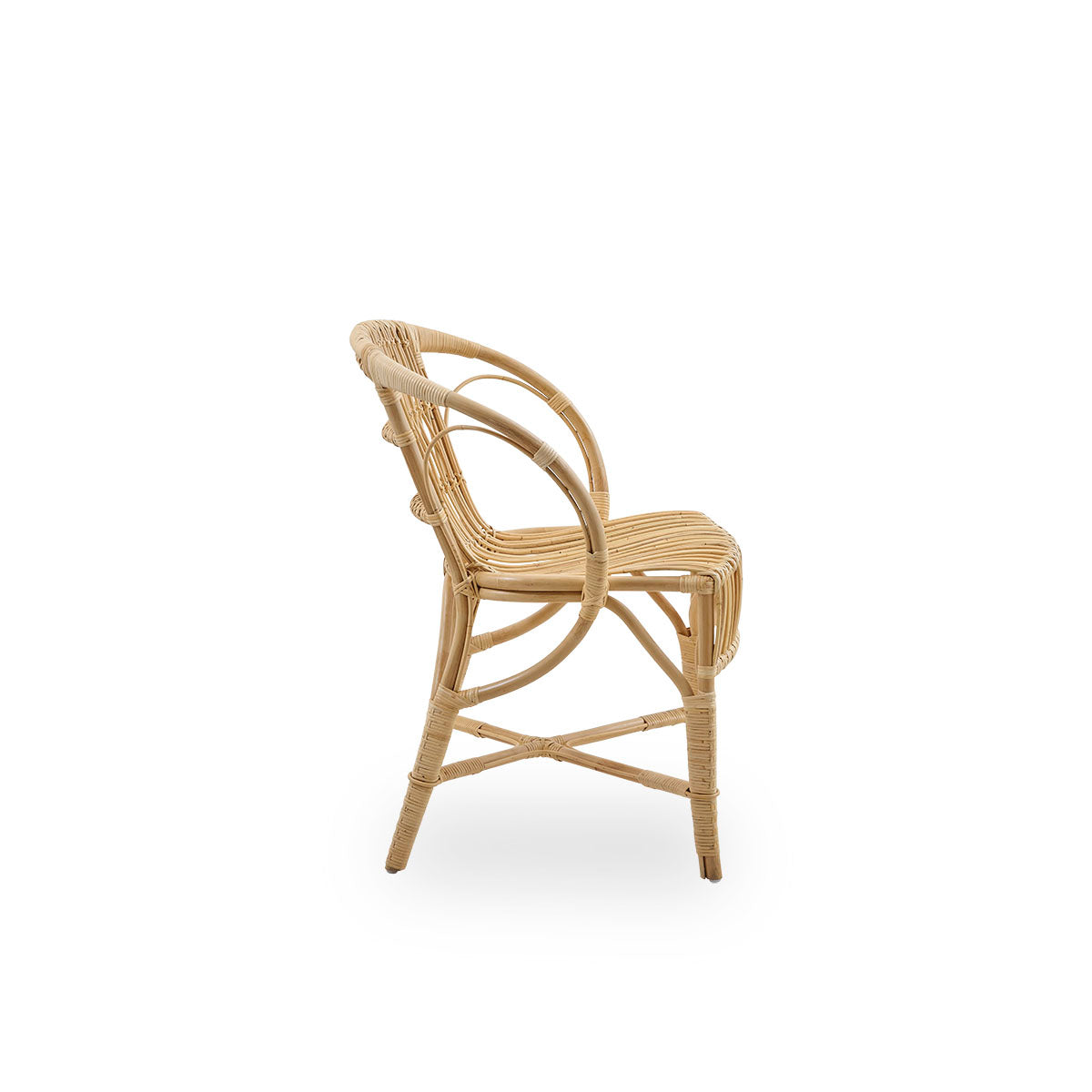 Plain side view of Robert dining chair in natural color designed by Robert W. Elegant wicker chair handcrafted from high-quality Indonesian rattan.