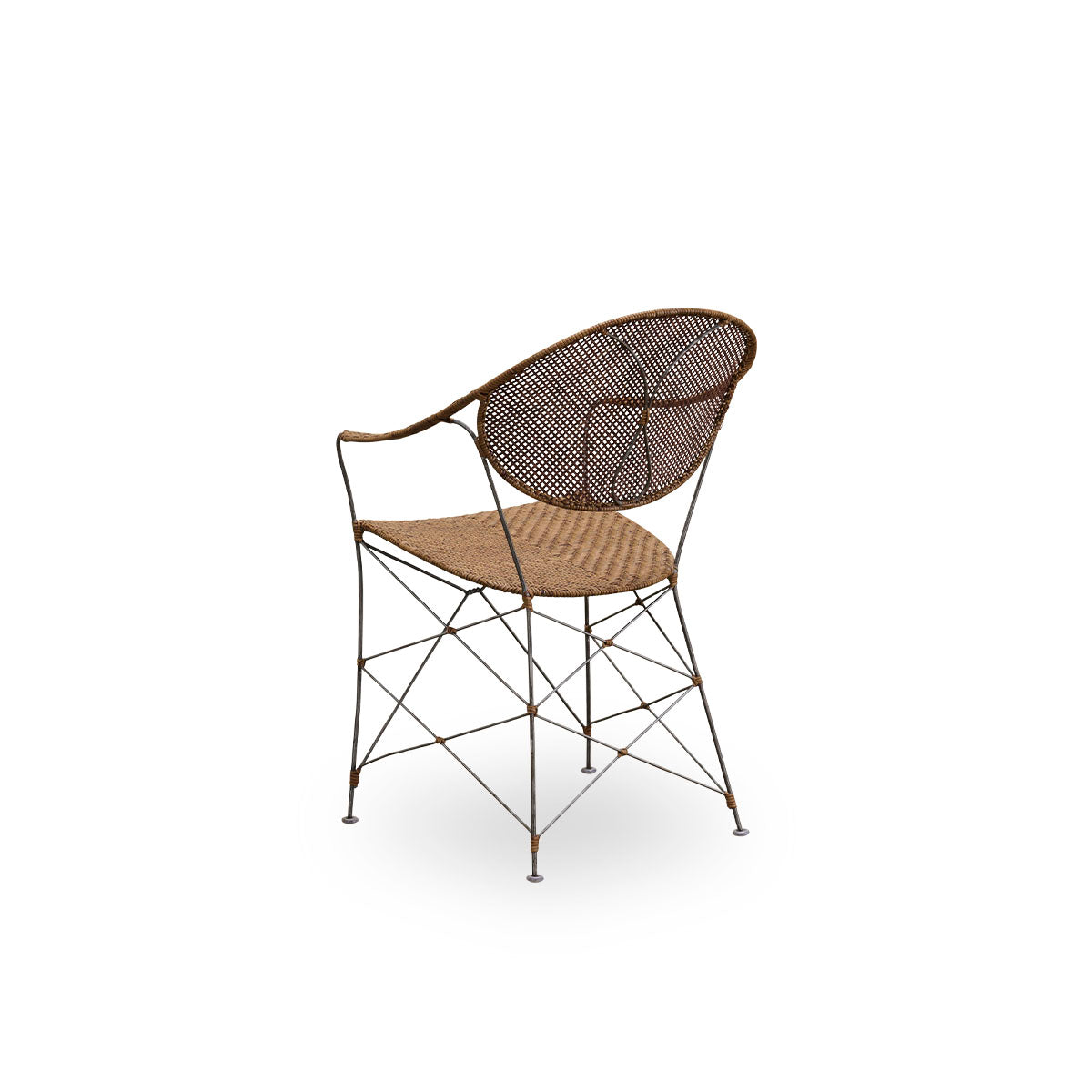 Back side view of the Funky dining chair designed by Yuzuru Yamakawa.
The chair has a steel frame with a handwoven seat and backrest made from high-quality Indonesian rattan in hazelnut color.
