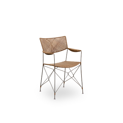 Side view of Rap dining chair designed by Yuzuru Yamakawa. Steel frame with seat and backrest handwoven with Indonesian rattan, lightweight chair combining Japanese design with traditional indonesian craftsmanship.