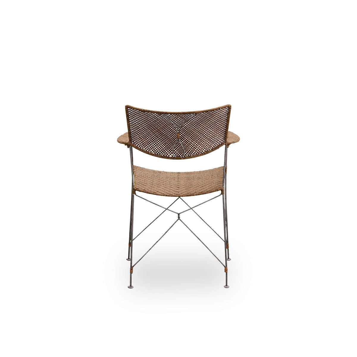 Plain back view of Rap dining chair designed by Yuzuru Yamakawa. Steel frame with seat and backrest handwoven with Indonesian rattan, lightweight chair combining Japanese design with traditional Indonesian craftsmanship.