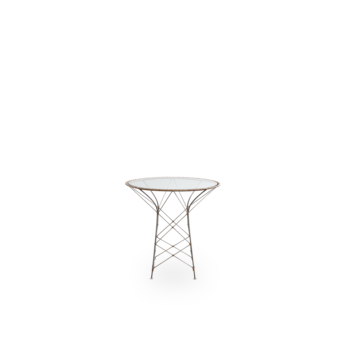 Front view of the Funky café table designed by Yuzuru Yamakawa.
The table has a round glass tabletop and a steel frame handwoven with Indonesian rattan in hazelnut color.